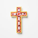 Decorative cross with colorful patterns on a white background