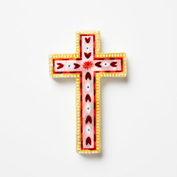 Decorative cross with colorful patterns on a white background