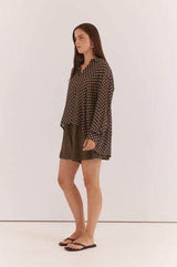 Relaxed fit, long-sleeve Joy Shirt in brown with a white polka dot pattern, crafted from lightweight viscose.