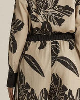 High-rise wide-leg June pants in a beige and black floral print with double pleat detailing.