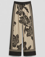 High-rise wide-leg June pants in a beige and black floral print with double pleat detailing.