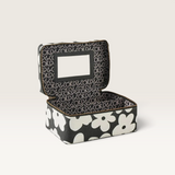 Kip & Co black and white floral cotton canvas toiletry case with internal mirror and structured hard-shell design.