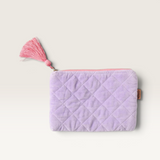 Kip&Co quilted velvet cosmetics purse in light purple with a contrasting pink tassel zip closure.