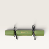 Kip&Co moss green velvet eye mask gift cracker with black ribbon ties, presented in a decorative festive tube.