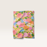 House of Holabox Kip&Co linen blend tea towel featuring a vibrant yellow floral botanical print with pink and blue flowers