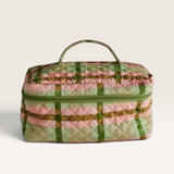 House of Holabox Kip & Co quilted cotton toiletry case in a green, pink, and white tartan pattern with a top handle.
