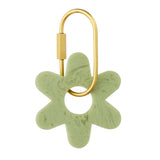 Sage green Kip resin flower key ring with a high-gloss finish and a brass-look D-lock clasp.