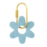 Light blue Kip resin flower key ring with a brass-look D-lock clasp, 7cm in length.
