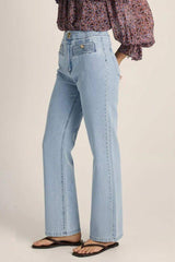 Light-wash high-rise straight leg jeans with gold-tone button accents and textured front pocket panels.