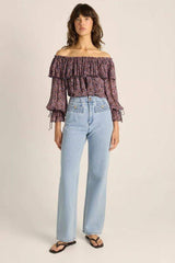 Light wash high-rise straight leg jeans with textured pocket panels and gold-tone button accents.