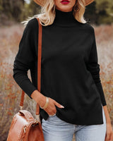 Woman wearing a black high-neck knit sweater with long sleeves and a ribbed hem, styled with blue jeans and a brown bag.