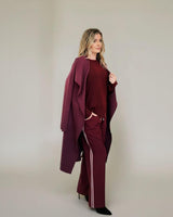 Wine-colored Maddison joggers featuring a relaxed fit, elasticated drawstring waistband, and side stripe detail.