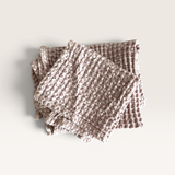 Mama and Tochter hand towel in muted dusty pink cotton with a chunky waffle weave and softly stone-washed texture.