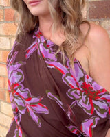 Margo one-shoulder maxi dress in brown viscose yoryu with a vibrant purple and red floral print.