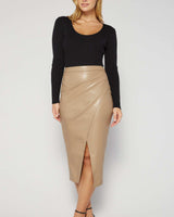 Latte-colored vegan leather midi skirt with a flattering wrap-front design and front slit.