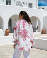 Flamingo pink botanical print linen blend shirt with 3/4 smock cuff sleeves and a relaxed fit.