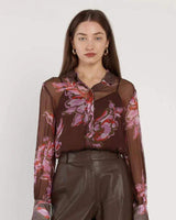 Nyomi blouse in sheer brown viscose with a pink floral print, featuring a button-up collar and matching camisole.