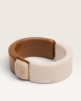 House of Holabox Sunday Best Bangle in coffee swirl resin with polished gold detailing and a hinged opening.