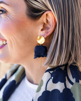 Olivia matte gold and navy flower petal dangle earrings featuring a layered floral design on a gold post.