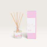 Palm Beach Collection 50ml mini reed diffuser in Pomelo & Dewberry scent with glass bottle and pink packaging.