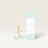 Palm Beach Collection 50ml mini reed diffuser in Sea Salt with glass bottle, wooden reeds, and light blue packaging.