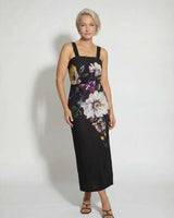 Model wearing a black cotton-nylon Providence midi dress with a square neckline and bold floral print.