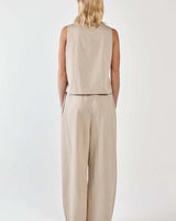 Back view of beige striped Renee paper bag pants paired with a matching sleeveless top.