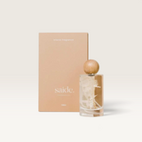 House of Holabox Saide. interior fragrance spray in a glass bottle with cream botanicals and a round wooden cap.