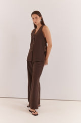 Dark brown Nevra Side Panel Vest with a V-neck and button-up front, worn with matching trousers.