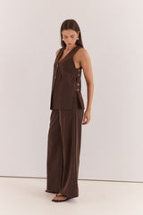 Nevra Side Panel Vest in dark brown with a V-neck, sleeveless design, and buttoned side panel detailing.