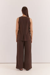 Back view of a dark brown Nevra Side Panel Vest featuring a sleeveless design and subtle side panel detailing.