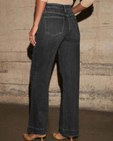 Back view of charcoal grey mid-rise straight leg cotton denim jeans with back pockets and a clean hem.