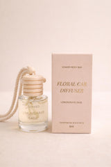 Soaked Body Bar floral car diffuser with wooden lid and hanging rope releasing fragrance