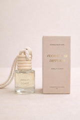 Soaked Body Bar Floral Car Diffuser with wooden lid hanging in car interior
