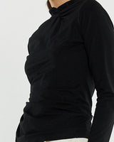 Black long-sleeve stretch jersey top featuring a boat neckline and a stylish knot detail at the neck and side seam.