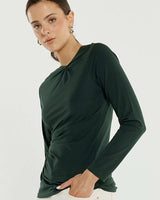 Bottle green long-sleeve stretch jersey top featuring a boat neckline and elegant knot detail at the shoulder and side.