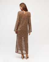 Back view of a cocoa-toned open weave mesh maxi dress with shimmering sequins and a slip lining.