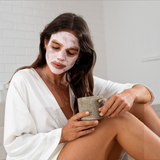 Facial clay mask, Stray Willow Pink Vitamin C, shown as a pale pink botanical mask applied across the face.