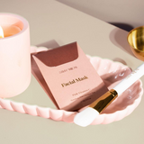 Facial mask, Stray Willow Pink Vitamin C, in a soft pink paper sachet with gold lettering and applicator brush.