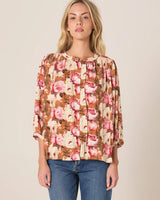 Floral print long sleeve top with stand collar, button front, and lace ladder trim in a relaxed viscose-linen blend.
