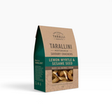 Tarallini Lemon Myrtle savoury crackers in kraft paper packaging with teal label, featuring sesame seeds and lemon myrtle flavor.