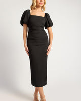 Black stretch crepe midi dress with puff sleeves, square neckline, and ruched front detailing.