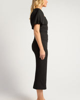 Black stretch crepe midi dress with puff sleeves, a square neckline, and a flattering ruched front detail.
