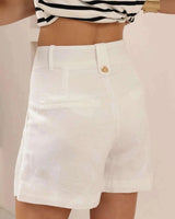 Tailored white linen-blend Victoria shorts featuring a high-waisted design, belt loops, and a single back button detail.