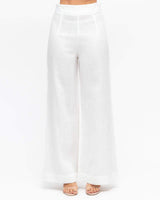 White wide-leg linen pants with a high-waisted, seamless front design and a clean, minimalist silhouette.