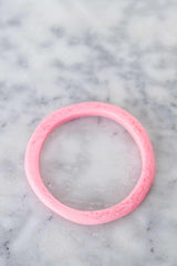 Colorful handmade Wave Resin Stacking Bangles in assorted colors, layered for a textured look