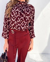 Burgundy and white patterned Willow tie-front blouse with a frill neckline and relaxed raglan sleeves.