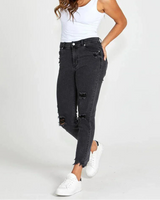 woman wearing black distressed Suzi Jean with mid rise and slim fit